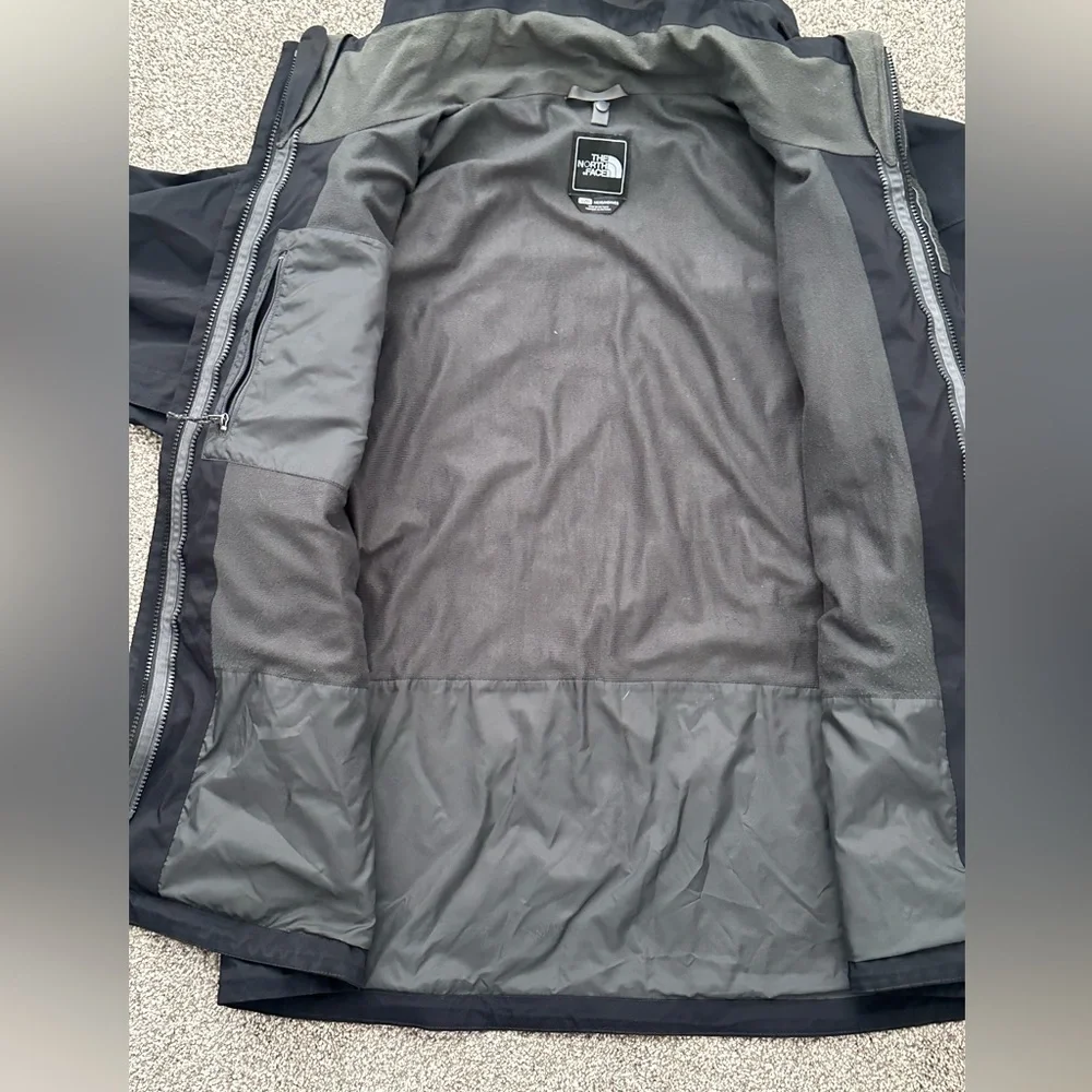 The North Face Black Hooded Raincoat with Multiple Front Pockets